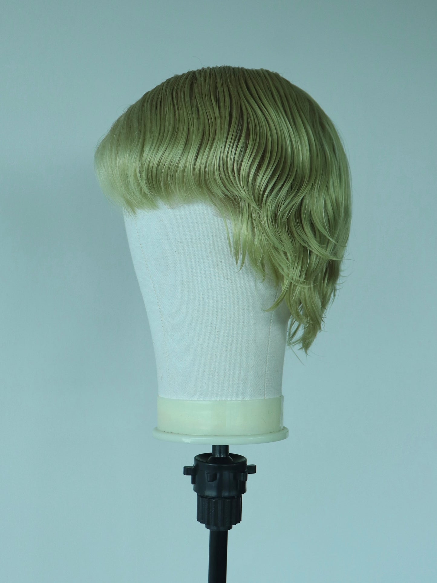 Light green short shaved sides mullet