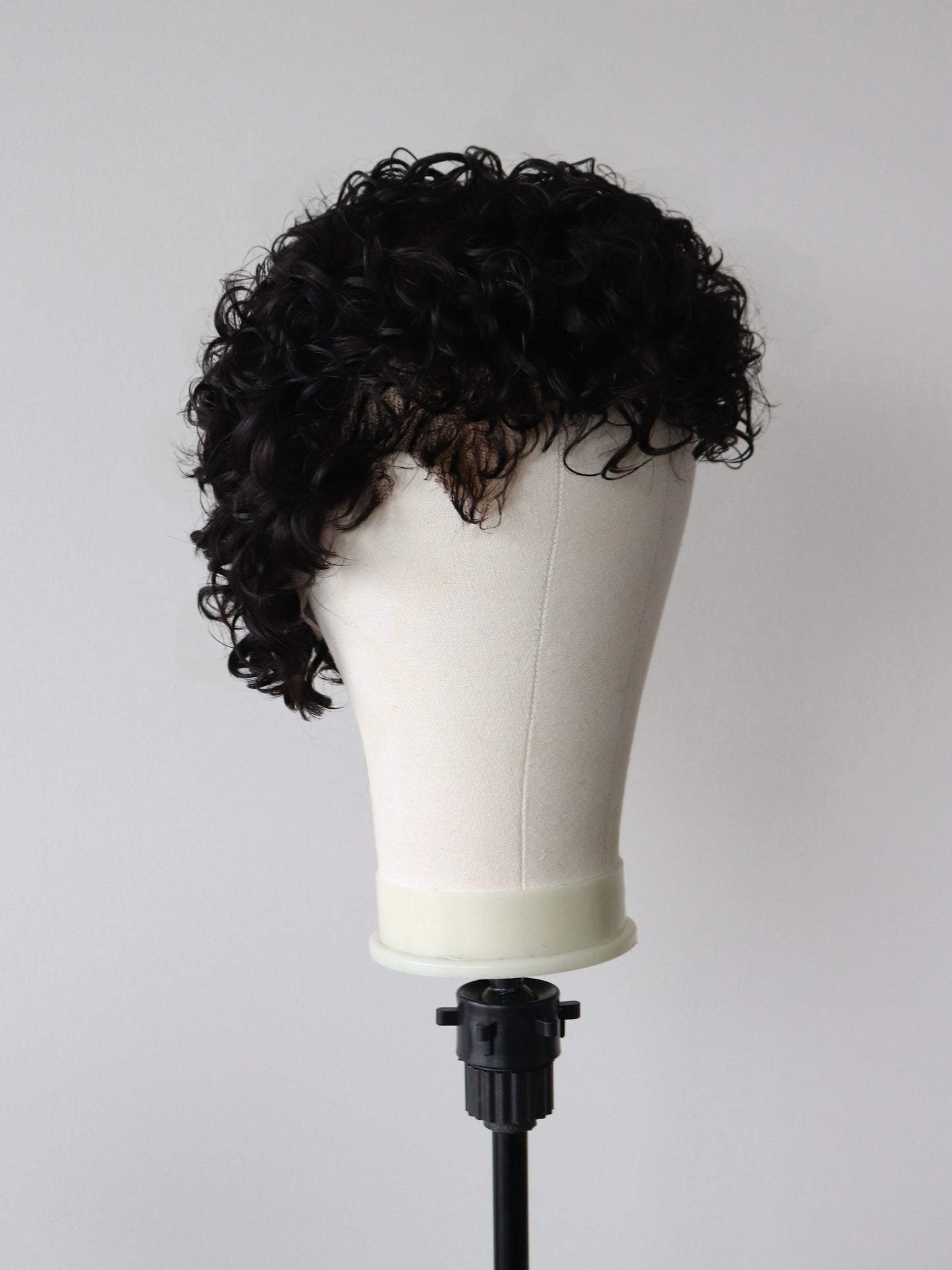 Shaved sides curly mullet