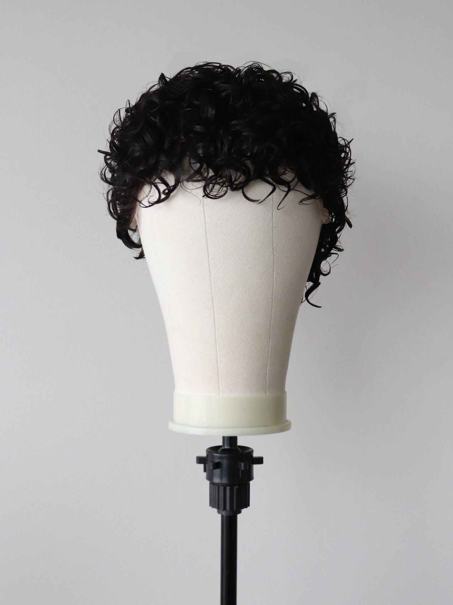 Shaved sides curly mullet